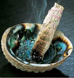 Smudging the stick image in a bowl