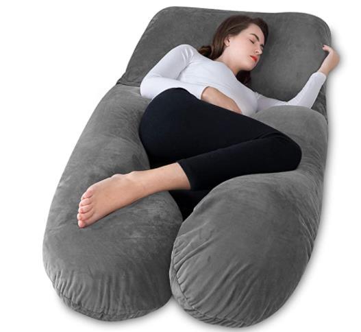 Pregnant Woman laying down on a Meiz Pregnancy Pillow 