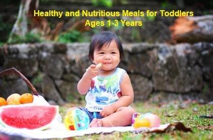 Young Toddler enjoy fresh nutrition food while sitting on a blanket with rock and plants in the background
