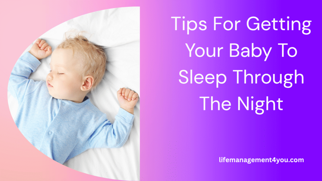 Sleeping baby in light blue pajamas on a white bed with overlay text: Tips for Getting Your Baby to Sleep Through The Night. Sleeping baby in light blue pajamas on a white bed with overlay text: Tips for Getting Your Baby to Sleep Through The Night.